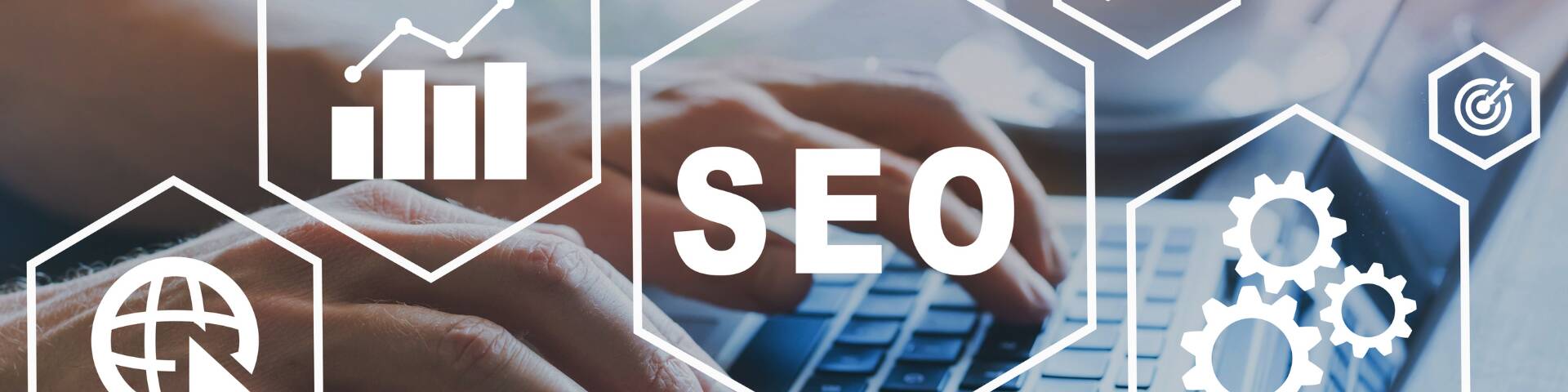 Hands typing on a laptop with SEO-related digital icons overlay, representing local SEO strategies for businesses. LMA Marketing & Advertising explains why local SEO is essential for visibility and growth.